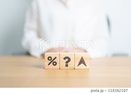 wood block of Question mark with percentage change to UP and Down arrow. Interest rate, GDP, stocks market, financial, deflation and Inflation, ranking, mortgage, debt, Loan and Economic Recession 118382107