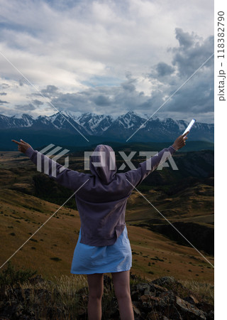 Woman in blue dress in summer Altai mountains Woman in blue dress in summer Altai mountains 118382790
