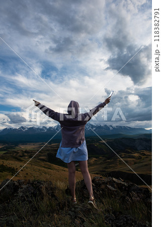Woman in blue dress in summer Altai mountains Woman in blue dress in summer Altai mountains 118382791