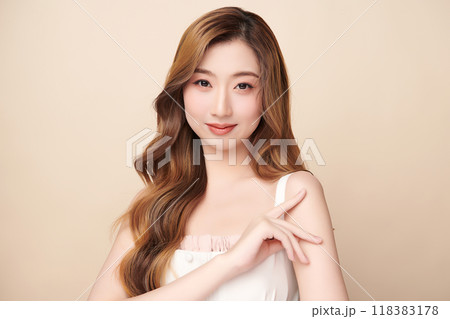 Beautiful young asian woman with clean fresh skin on beige background, Face care, Facial treatment, Cosmetology, beauty and spa, Asian women portrait. Beautiful young asian woman with clean fresh skin on beige background, Face care, Facial treatment, Cosmetology, beauty and spa, Asian women portrait. 118383178