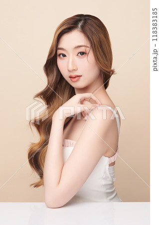 Beautiful young asian woman with clean fresh skin on beige background, Face care, Facial treatment, Cosmetology, beauty and spa, Asian women portrait. Beautiful young asian woman with clean fresh skin on beige background, Face care, Facial treatment, Cosmetology, beauty and spa, Asian women portrait. 118383185