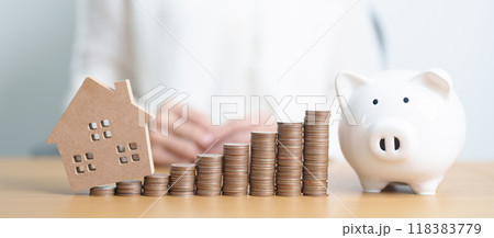 Money Saving, Property investment, House Mortgage, Loan and Real Estate Financial concepts. woman with coins stack piggy bank and Home model, Money stack Counting arrangement for deposit and Tax Money Saving, Property investment, House Mortgage, Loan and Real Estate Financial concepts. woman with coins stack piggy bank and Home model, Money stack Counting arrangement for deposit and Tax 118383779