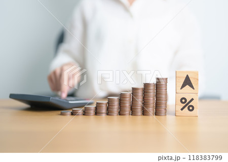 wood block of percentage change to UP and Down arrow with money coins stack. Interest rate, GDP, stocks market, financial, deflation and Inflation, ranking, mortgage, debt, Loan and Economic Recession 118383799