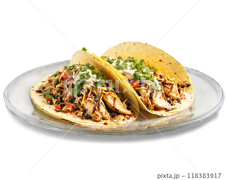 Chipotle Chicken Tacos with grilled chicken and chipotle cream served on a transparent glass dish 118383917