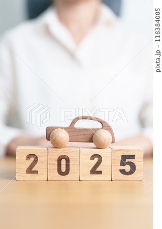 Happy New Year 2025 with Car model on table. Automobile Tax, Car Insurance, Financial, vehicle Repair and Maintenance and New Year concept Happy New Year 2025 with Car model on table. Automobile Tax, Car Insurance, Financial, vehicle Repair and Maintenance and New Year concept 118384005