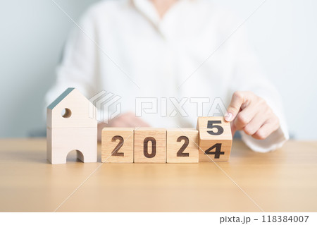 2024 end year to Happy New Year 2025 with house model. real estate, Home loan and mortgage, tax, investment, financial, savings and New Year Resolution concepts 2024 end year to Happy New Year 2025 with house model. real estate, Home loan and mortgage, tax, investment, financial, savings and New Year Resolution concepts 118384007