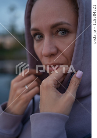 Woman sitting on the pier Woman sitting on the pier 118384321