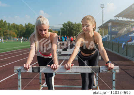 Two athlete young woman runner at the stadium Two athlete young woman runner at the stadium 118384696