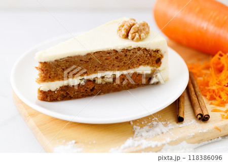 Slice of sweet carrot cake. Closeup. Slice of sweet carrot cake. Closeup. 118386096