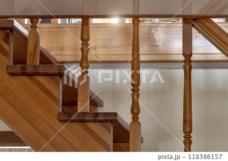 Fragment of a wooden staircase 118386157