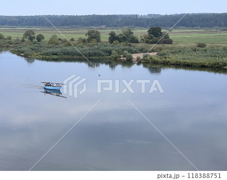 Lonely small boat in the river, shot in the air from hill in Lithuania, quit day Lonely small boat in the river, shot in the air from hill in Lithuania, quit day 118388751