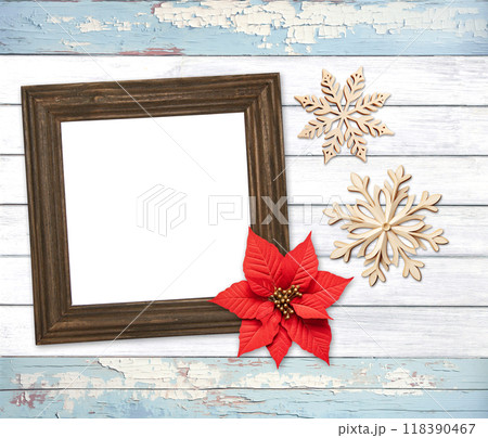 Eco friendly holiday backdrop. Christmas background with retro wooden frame, poinsettia, snowflake on wooden boards. Copy space for text. Ecology, environmental conservation, zero waste concept Eco friendly holiday backdrop. Christmas background with retro wooden frame, poinsettia, snowflake on wooden boards. Copy space for text. Ecology, environmental conservation, zero waste concept 118390467