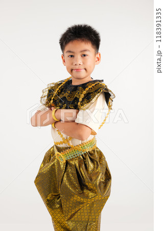 Portrait of Thailand kid boy smiling traditional Thai dress costume with arms crossed in studio shot isolated white background, Happy primary child lifestyle arm folded 118391335