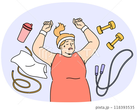 Fat woman lies on floor among fitness accessories, falling asleep after workout. 118393535