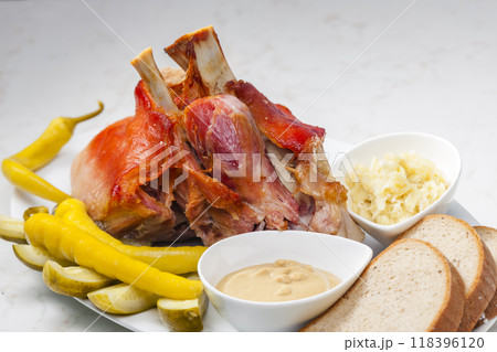 roasted pork knee with picked vegetables, bread and mustard 118396120