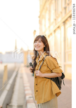 Traveler asian woman in her 30s enjoying travel in Bangkok, Thailand. Journey trip lifestyle, world travel explorer or Asia summer tourism concept. Traveler asian woman in her 30s enjoying travel in Bangkok, Thailand. Journey trip lifestyle, world travel explorer or Asia summer tourism concept. 118398764