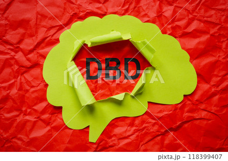 Torn paper brain and the abbreviation DBD Disruptive Behavior Disorder. 118399407