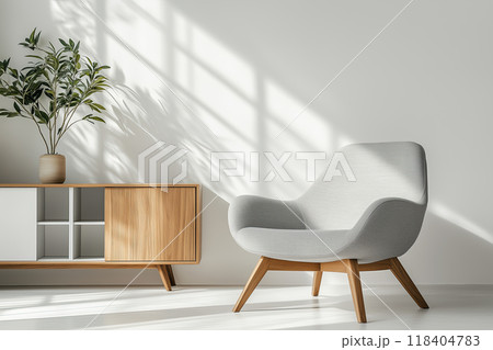 Minimalist Scandinavian-Style Lounge Chair with Wooden Legs in Sunlit Room Minimalist Scandinavian-Style Lounge Chair with Wooden Legs in Sunlit Room 118404783