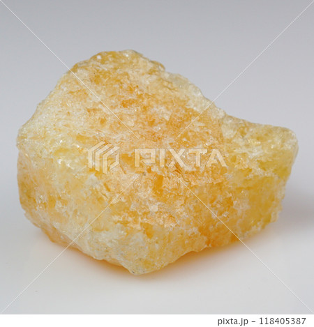 Lustrous Yellow Calcite Crystal on Pristine White Background 118405387