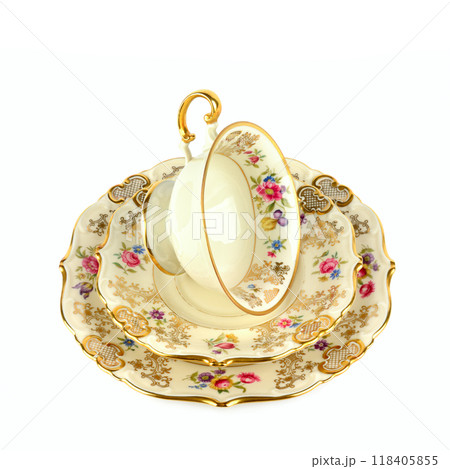 Vintage porcelain cups and saucer isolated on white. Vintage porcelain cups and saucer isolated on white. 118405855