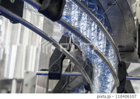 The overhead conveyor belt transport the drinking water bottle s for filling process. 118406107