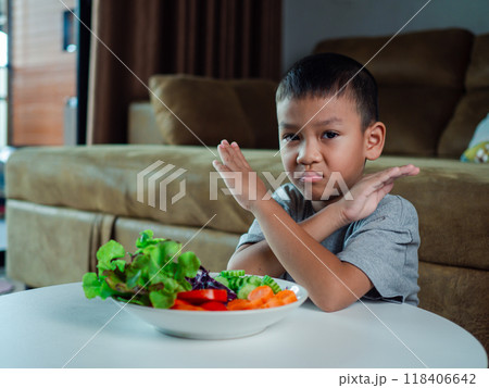 Children do not like to eat vegetables, Little cute boy refuses to eat healthy vegetables,  Nutrition healthy eating habits for kids concept, Children do not like to eat vegetables. 118406642