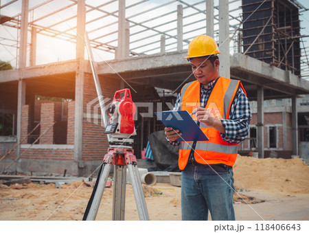 Team engineers checking and planning project working outdoors building side on a worksite, Engineering and architecture concept, Engineers having meeting regarding new construction phase. 118406643