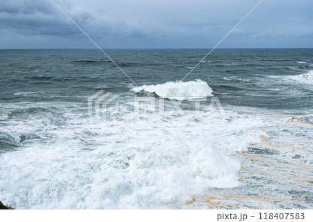 Big waves near the lighthouse at Praia do Norte, Nazare, Portugal 118407583