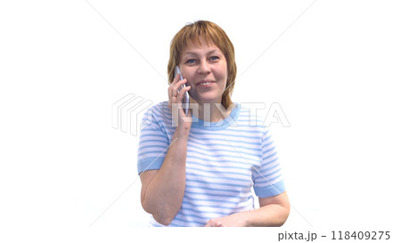 Young Woman Talking on Phone and Smiling Young Woman Talking on Phone and Smiling 118409275