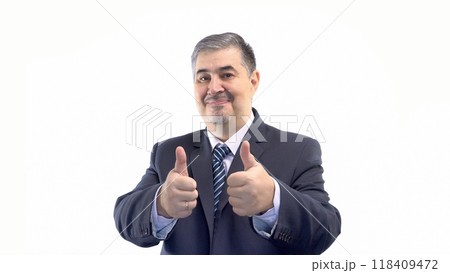 Businessman in Suit Smiling and Giving Thumbs-Up Businessman in Suit Smiling and Giving Thumbs-Up 118409472