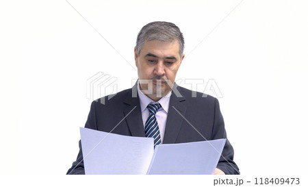 Businessman Reviewing Documents. Isolated on White Background. Businessman Reviewing Documents. Isolated on White Background. 118409473