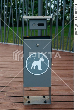 container for dog excrement in the park, close-up. place for walking dog in park. container for dog excrement in the park, close-up. place for walking dog in park. 118409831