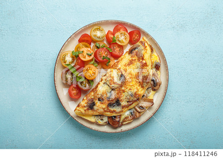Omelette with mushrooms and cherry tomatoes for healthy breakfast from above 118411246