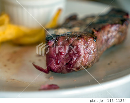 Beefsteak with french fries on a plate 118411284