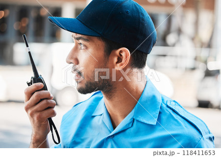 Security guard, safety officer or man on walkie talkie on a street for protection, patrol or watch. Law enforcement, serious and communication with crime prevention male worker in uniform in the city 118411653