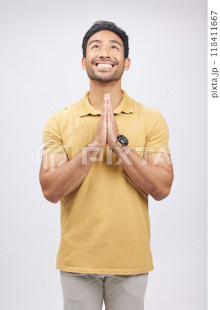 Man, prayer hands and studio with looking up, smile and communication with God by white background. Student, praying and mindfulness with religion, gratitude and worship for peace, hope or meditation Man, prayer hands and studio with looking up, smile and communication with God by white background. Student, praying and mindfulness with religion, gratitude and worship for peace, hope or meditation 118411667