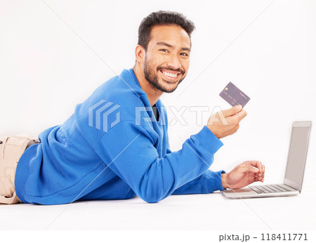 Online shopping, laptop and portrait man smile for credit card discount, fintech service or ecommerce sale. Studio customer, savings transfer payment or relax person banking on white background floor 118411771