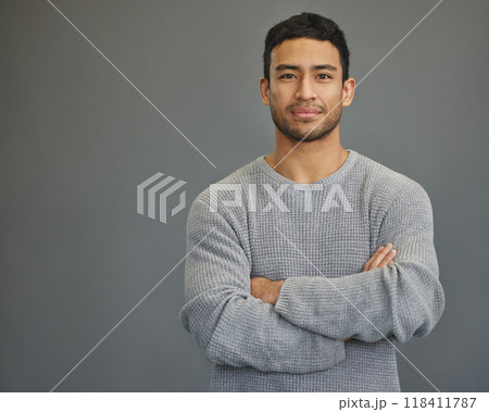 Portrait of man in studio with mockup space, arms crossed and confident smile on studio backdrop in casual fashion. Relax, confidence and face of male on grey background with focus, pride and mock up Portrait of man in studio with mockup space, arms crossed and confident smile on studio backdrop in casual fashion. Relax, confidence and face of male on grey background with focus, pride and mock up 118411787