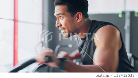 Man, cycling and training in gym, fitness and motivation for health, wellness and weight loss. Strong indian athlete, training and exercise for triathlon by cardio, sports and endurance or determined 118412035