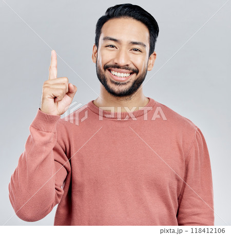 Smile, space and portrait of Indian man pointing up, mockup and product placement isolated on white background. Promotion, information and person showing deal announcement in studio with launch idea. Smile, space and portrait of Indian man pointing up, mockup and product placement isolated on white background. Promotion, information and person showing deal announcement in studio with launch idea. 118412106