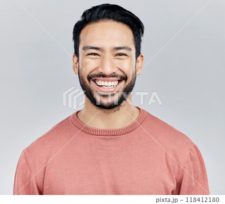 Face portrait, smile and happy Asian man in studio isolated on a white background or backdrop. Funny, fashion and young, confident and proud, handsome male model or person with positive mindset. 118412180