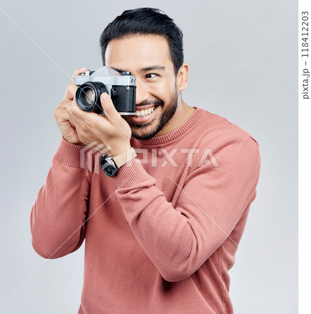 Man with camera, photography and happy with smile, taking picture with art isolated on studio background. Photographer, happiness and creativity with vintage technology with creative male artist 118412203