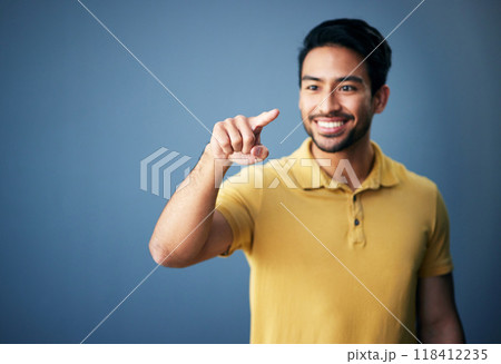 Happy, finger and man in studio with hand for mockup space or ai on a blue background. Smile of an asian male model person pointing for product placement and creative brand isolated for gradient logo 118412235