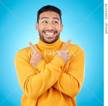 Happy, asian man and hands pointing in studio for choice, deal or sign up decision on blue background. Smile, direction and Japanese guy with recommendation, suggestion or coming soon launch platform 118412238