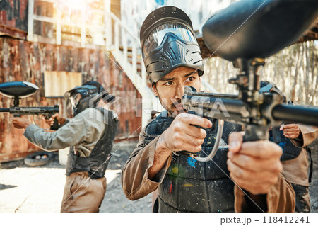 Teamwork, sports and paintball with man in game for playground, war and gaming. Challenge, mission and soldier with people shooting in battlefield arena for target, gun and warrior training Teamwork, sports and paintball with man in game for playground, war and gaming. Challenge, mission and soldier with people shooting in battlefield arena for target, gun and warrior training 118412241