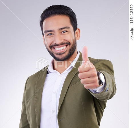Thumbs up, success and portrait of business man smile and happy for win isolated in a studio white background. Entrepreneur, Latino and corporate employee excited, thank you and agreement sign 118412529