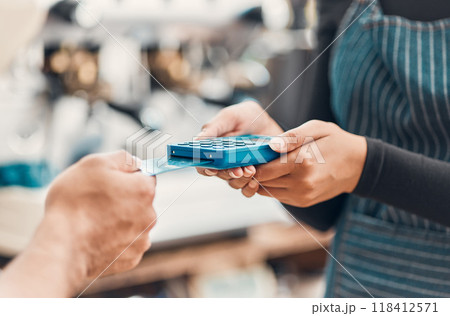 Credit card, machine and hands for payment in a coffee shop for shopping, bills or sale with technology. Contactless paying, electronic transaction or closeup of cafe customer at cashier for checkout Credit card, machine and hands for payment in a coffee shop for shopping, bills or sale with technology. Contactless paying, electronic transaction or closeup of cafe customer at cashier for checkout 118412571