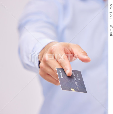 Credit card in hand, payment and shopping with man, purchase product or service isolated on white background. Closeup, commerce and customer, buying with promotion and sale, shop and male in studio 118412609