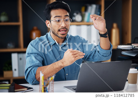Asian man, laptop and consulting in video call for communication with earphones at office desk. Male employee explaining project plan in webinar, virtual meeting or talking on computer at workplace 118412785