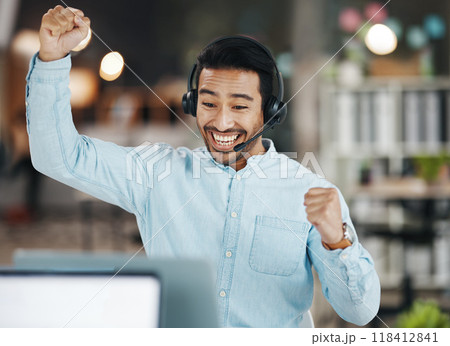 Asian man, call center and celebration for winning, sale or discount on laptop in telemarketing at office. Happy and excited male consultant agent in joy for win, victory or achievement on computer 118412841